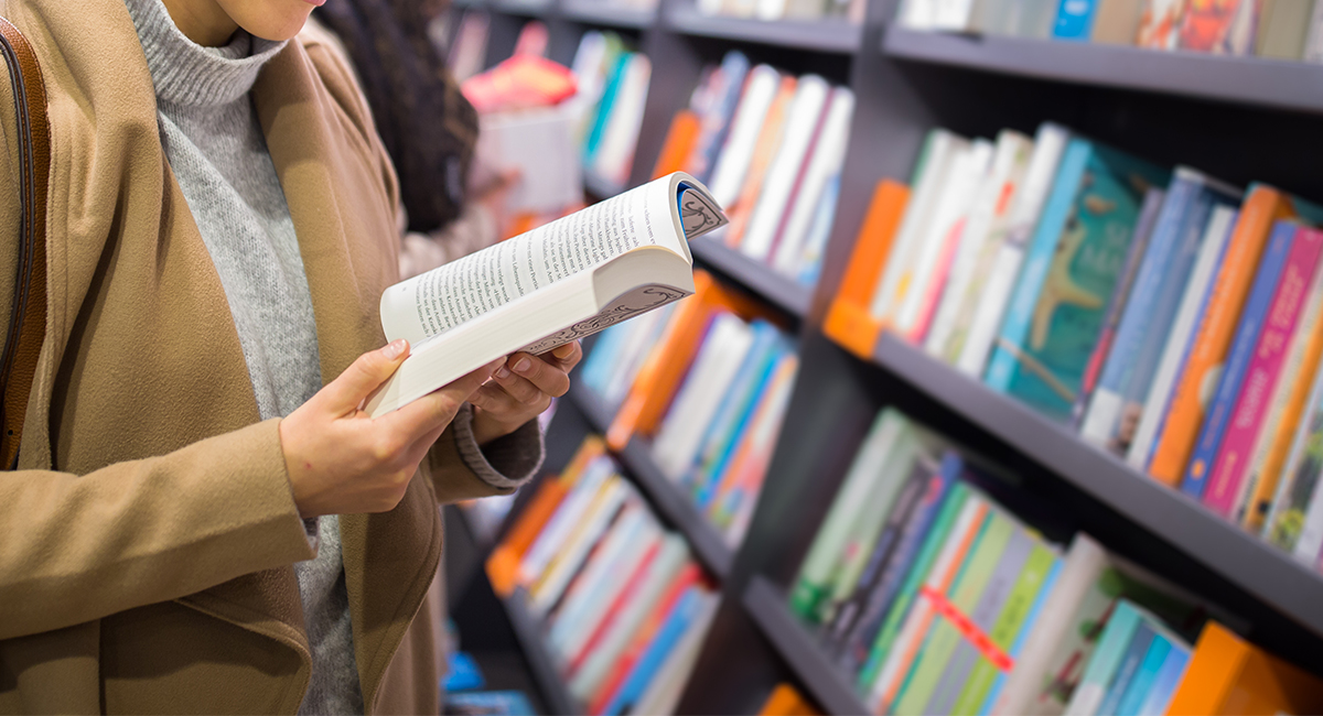 Reading a book in a bookstore Books