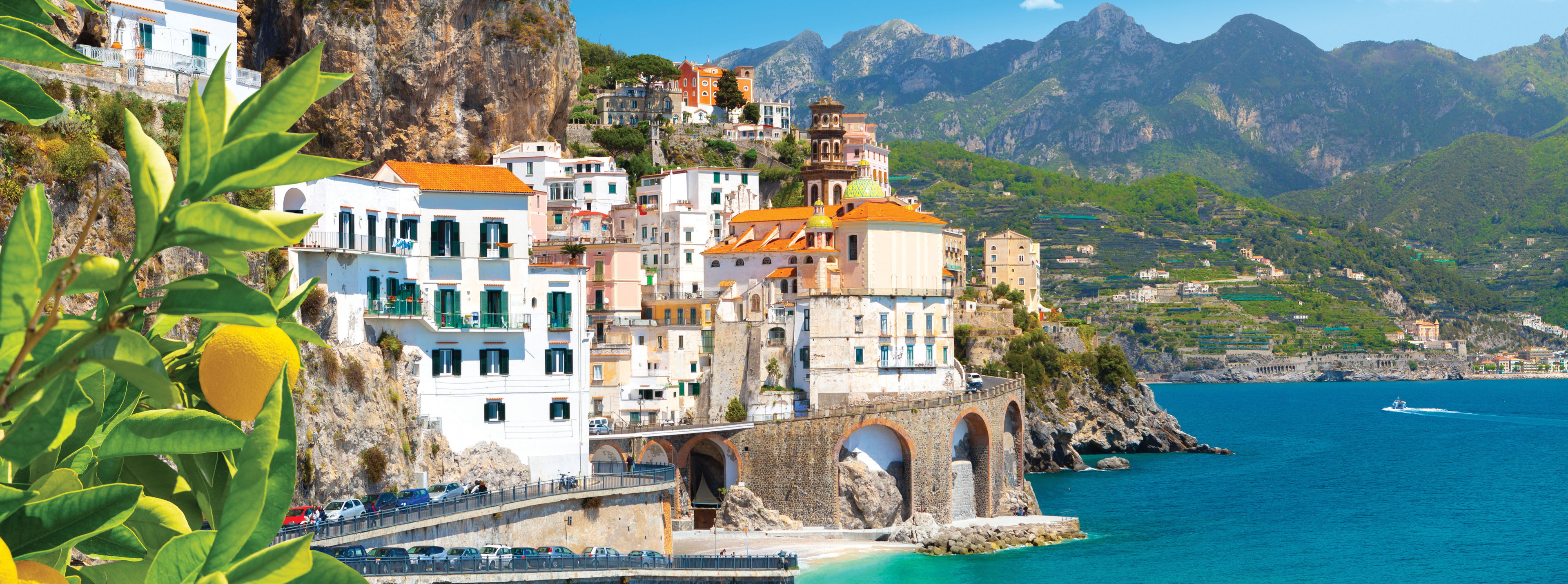 Costal view of Amalfi, Italy with colorful cliffside buildings and turquoise sea. Amalfi Coast in Italy