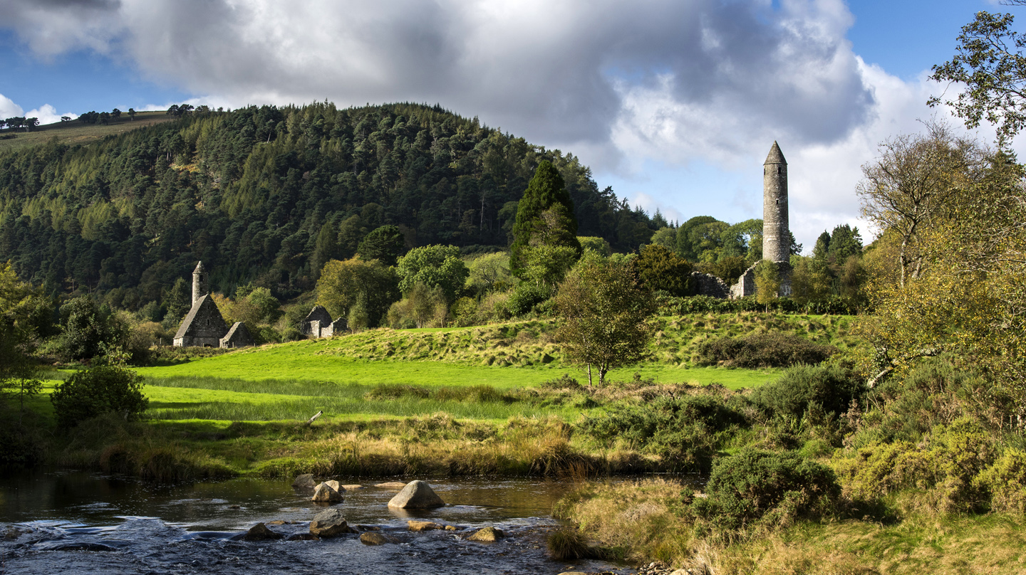 The ruins of Glendalough, an old monastery set in a  lush green valley