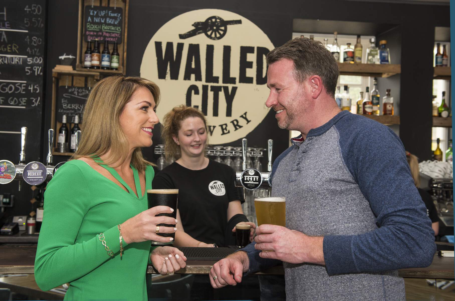 Couple having a drink at Walled City Brewery