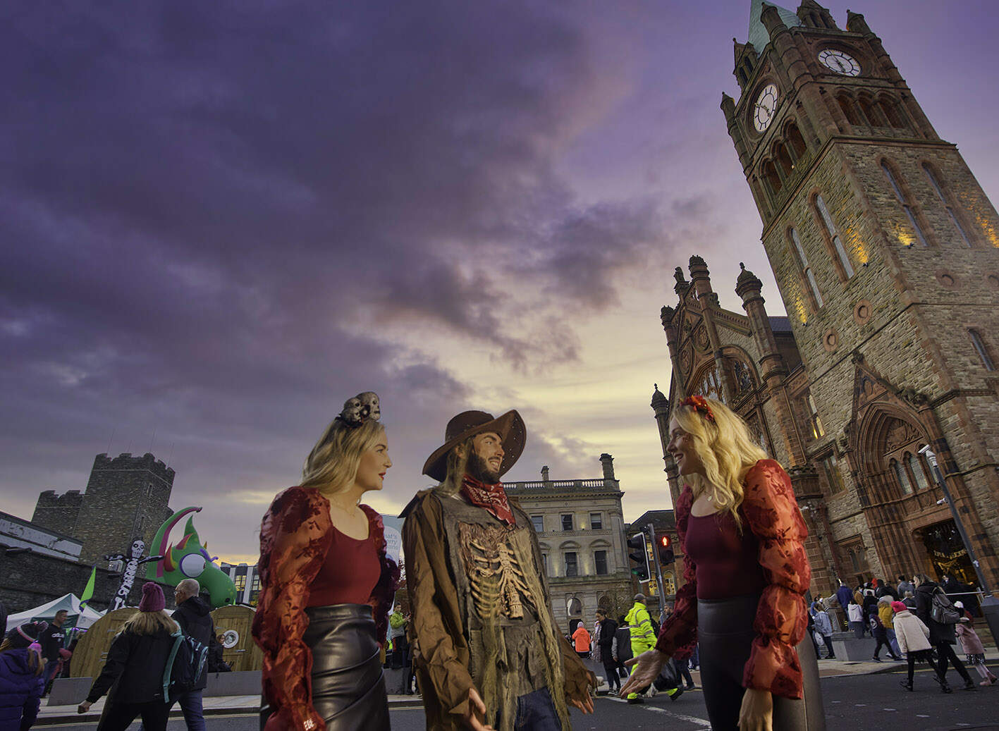 Derry revelers in costume outside the Guild Hall