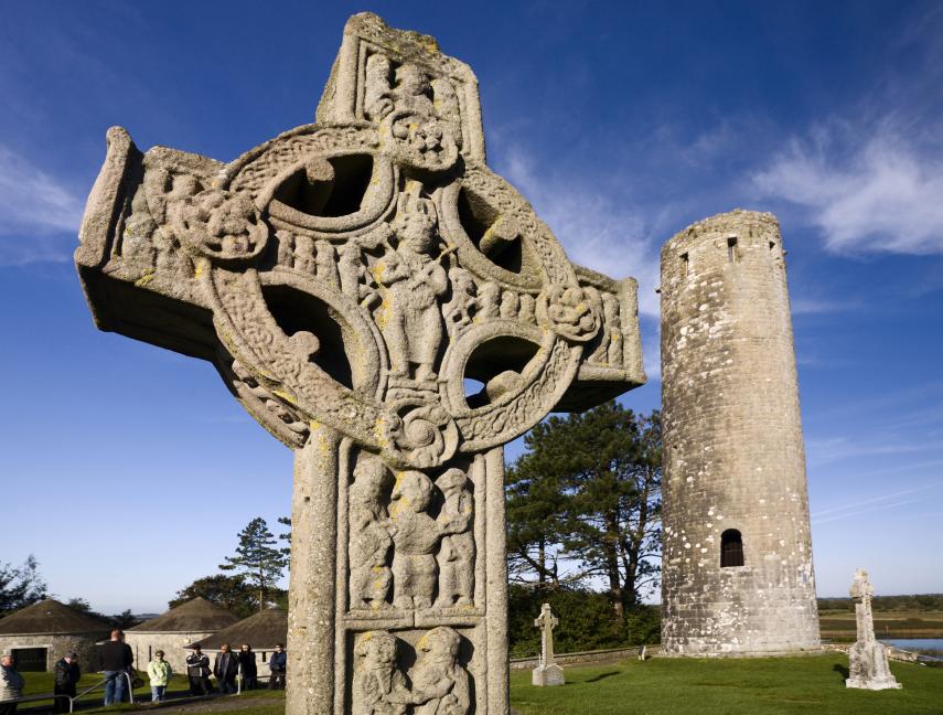 A carved stone Celtic cross in the ruins of Clonmacnoise, Ireland