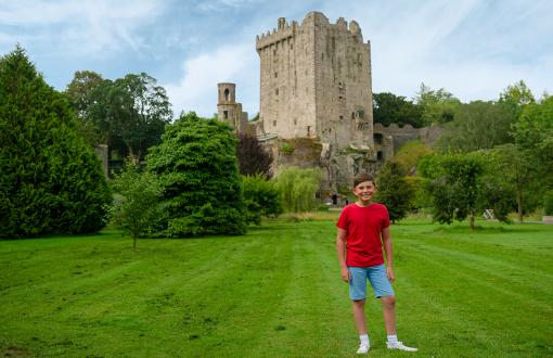 Boy in front of Blarney Castle