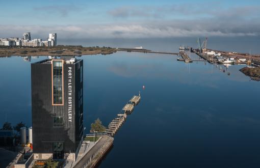 Port of Leith Distillery, a nine-story building rising up above the water.